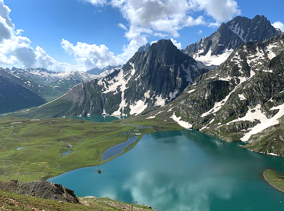 double exposure of woman with eyes closed and sky and trees
